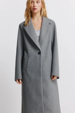 Abrigo largo bolsillos diagonales